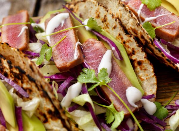 ahi tuna tacos with avocado cilantro and red cabbage